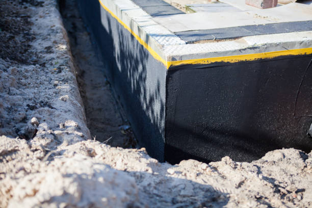 Professional Wet Basement Repair technician working in Okeana, OH